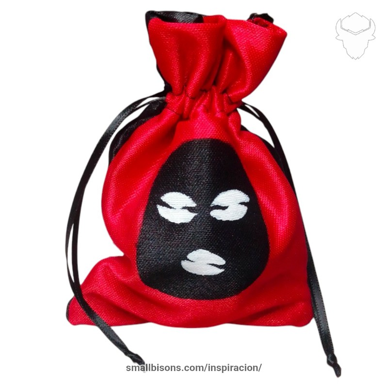 Bolsa de caracoles con eshu pintado en el centro y cinta negra